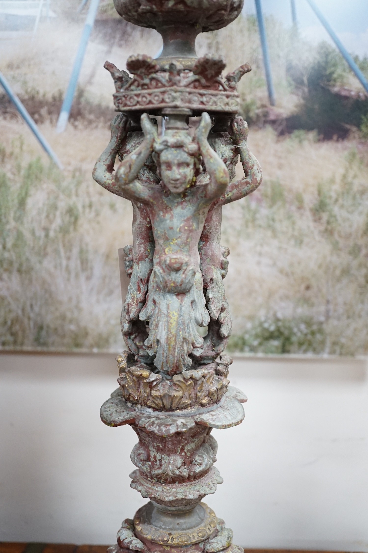 A pair French cast metal candlesticks. 47cm tall